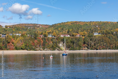 Panorama of Tadoussac, Quebec, Canada from the St. Lawrence River on an Autumn Day with Fall Colors Reflected in the Water