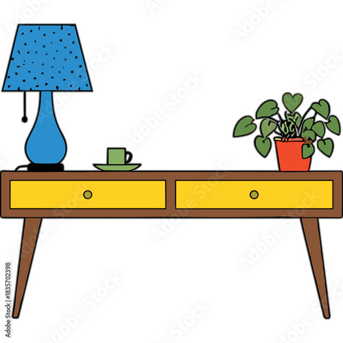 A Blue Table Lamp Sits Next To A Green Coffee Cup And Saucer On A Yellow Two Drawer Desk With A Potted Plant On The Right Side