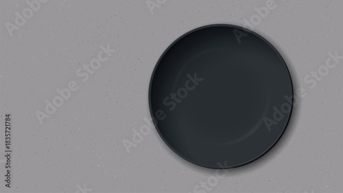Top view of empty black bowl placed on a cement texture background