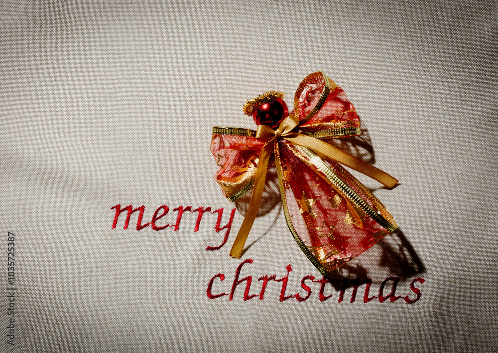 Obraz premium Merry Christmas decoration with angel and ribbon