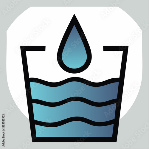 Close-up of a water droplet falling into a glass of water creating ripples.