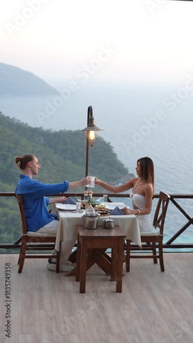 A couple enjoying a romantic dinner together in a warm and intimate atmosphere, capturing love, connection, and elegant holiday dining moments.