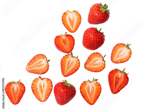 Fresh, juicy strawberries, whole and halved, scattered against a stark black backdrop