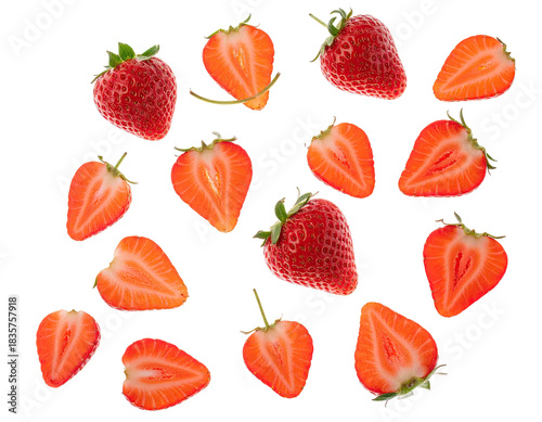 A collection of ripe, red strawberries; some whole, others sliced in half, on a black backdrop