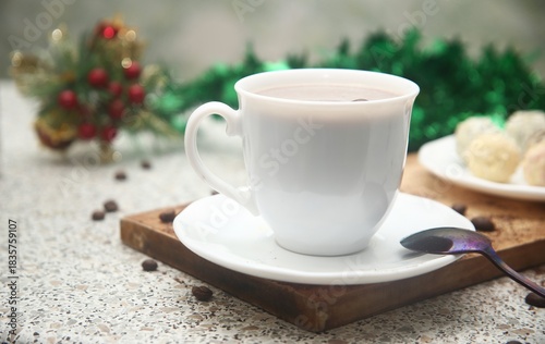 cup of coffee and christmas decorations