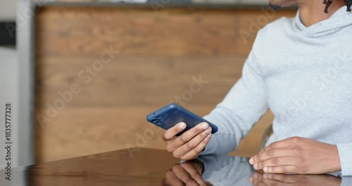 Diverse customer and barista exchanging smartphone payment at cafe after presenting POS terminal