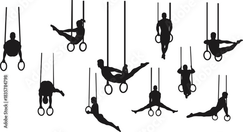 Male and female gymnasts performing on rings in silhouette gymnastics