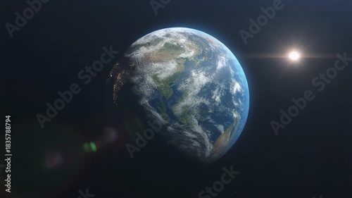 A 3d rotating blue planet earth globe with a dark atmosphere floats in the black universe space near the sun and moon showing the world map with the america and europe continents