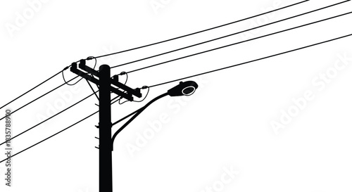 Black and white silhouette of utility pole with streetlight and multiple power lines crossing urban skyline, minimalist vector illustration for infrastructure design