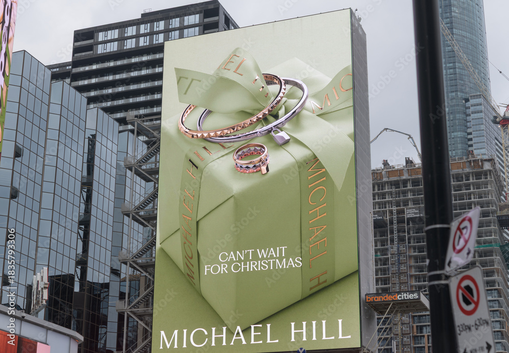 Fototapeta premium digital billboard with Michael Hill advertisement facing Sankofa Square, Toronto