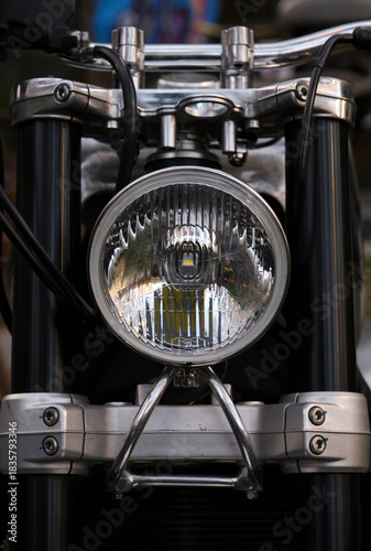 Close-up of the headlights of a vintage motorcycle.