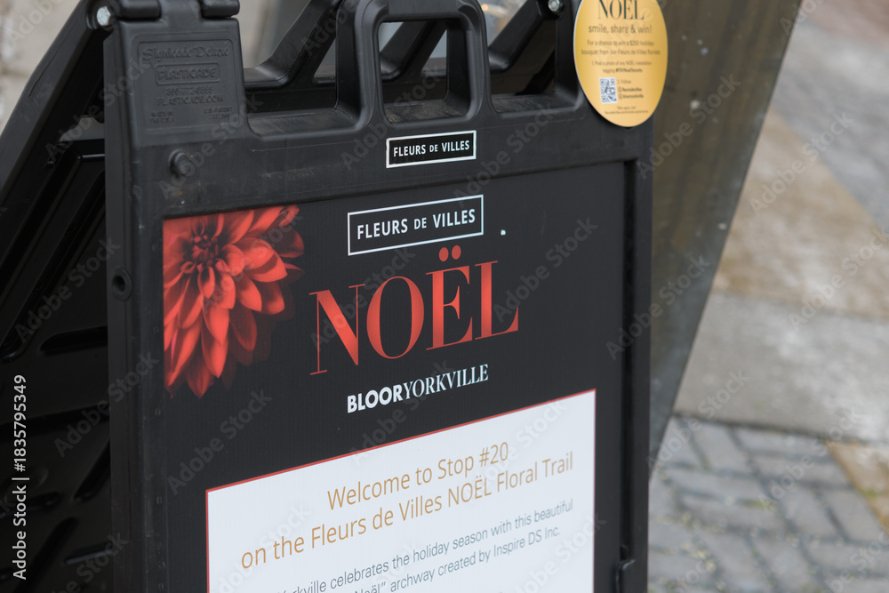 Fototapeta premium sidewalk Fleurs de Villes NOËL sign, Bloor-Yorkville, Toronto