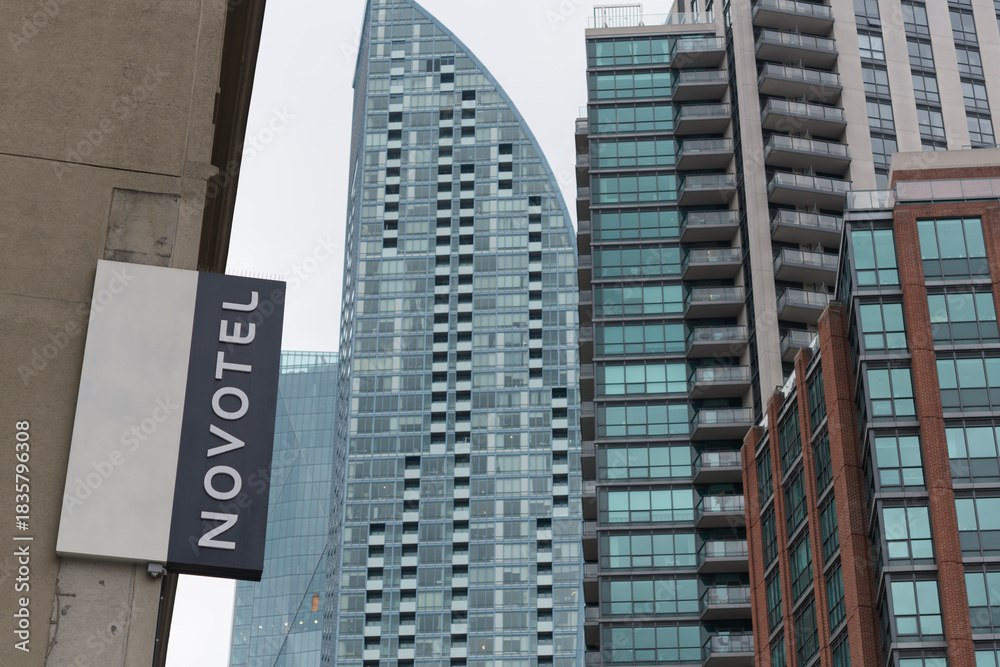 Fototapeta premium projecting sign outside Novotel Toronto Centre, four-star hotel, located at 45 The Esplanade