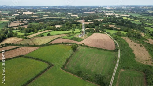 Flight over the Breton countryside with its rolling hills, ending at a telecommunications tower - Vol au dessus de la campagne bretonne en bocage avec final sur un pylône télécom