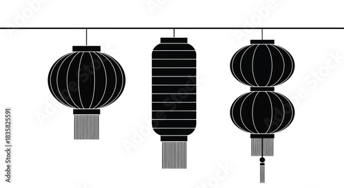 Three black and white decorative lanterns of different shapes hanging from a line, showcasing traditional Asian design elements.