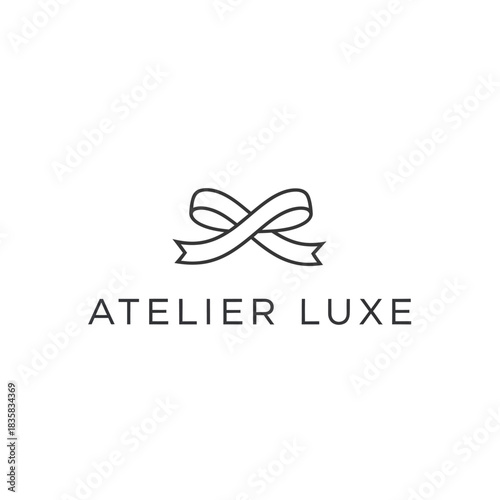 Elegant Atelier Luxe Logo Featuring a Stylish Bow Design.