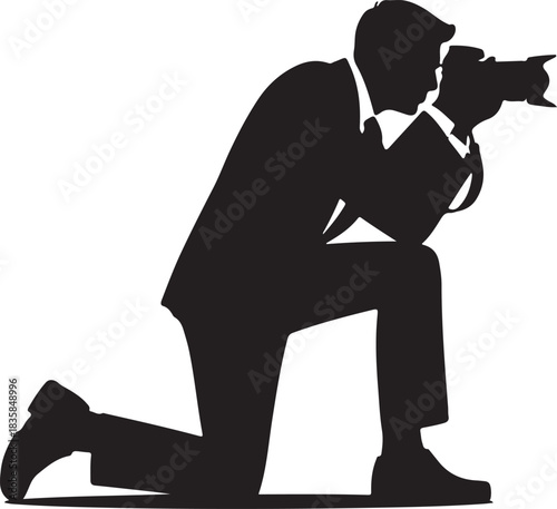 Black silhouette of a man in a suit kneeling and taking a photo with a camera person photographer
