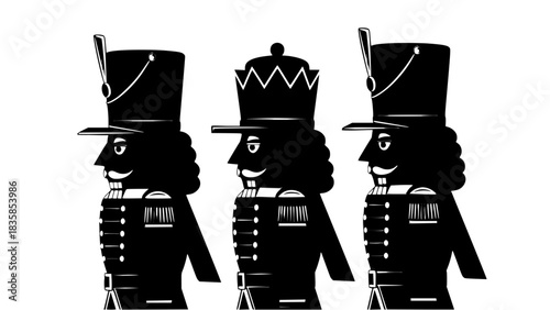 Three Black and White Nutcracker Soldiers Standing in a Row on a White Background