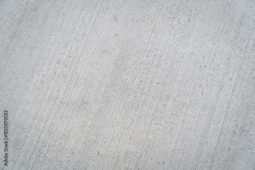 Close up concrete with brushed finish diagonal lines backdrop