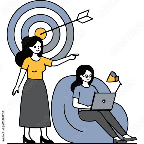 Two women collaborating on a project one standing pointing at a target and the other working on a laptop in a beanbag chair with a desk lamp illuminating the scene