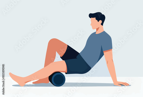 A person with dark hair, wearing a gray shirt and shorts, is using a foam roller on their leg