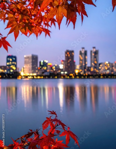 City skyline reflected in evening water