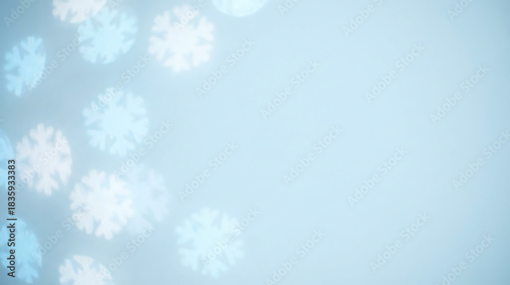 Naklejka premium Creative blue Christmas background featuring shaped snowflake bokeh lights with copy space for winter holiday designs