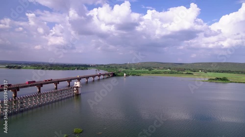 Wallpaper Mural Ghataprabha river with Ghataprabha main bridge, moving vehicles and greenery at karnataka, india. day time, orbit shot, drone shot, 4k. Torontodigital.ca