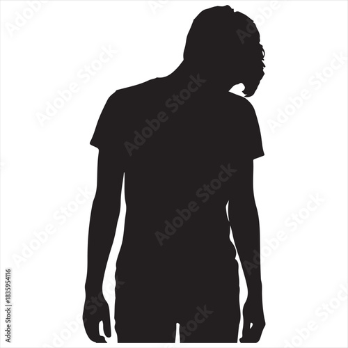 Silhouette of a person with a hunched posture and head bowed conveying a sense of sadness or contemplation