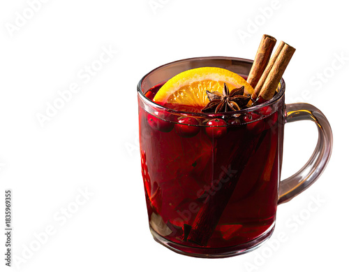 Warm drink in a clear mug, garnished with fruit, spices, and a slice of orange