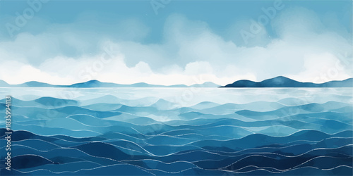 Blue sea and mountains landscape with morning sun, clouds, and fog creating a beautiful winter view