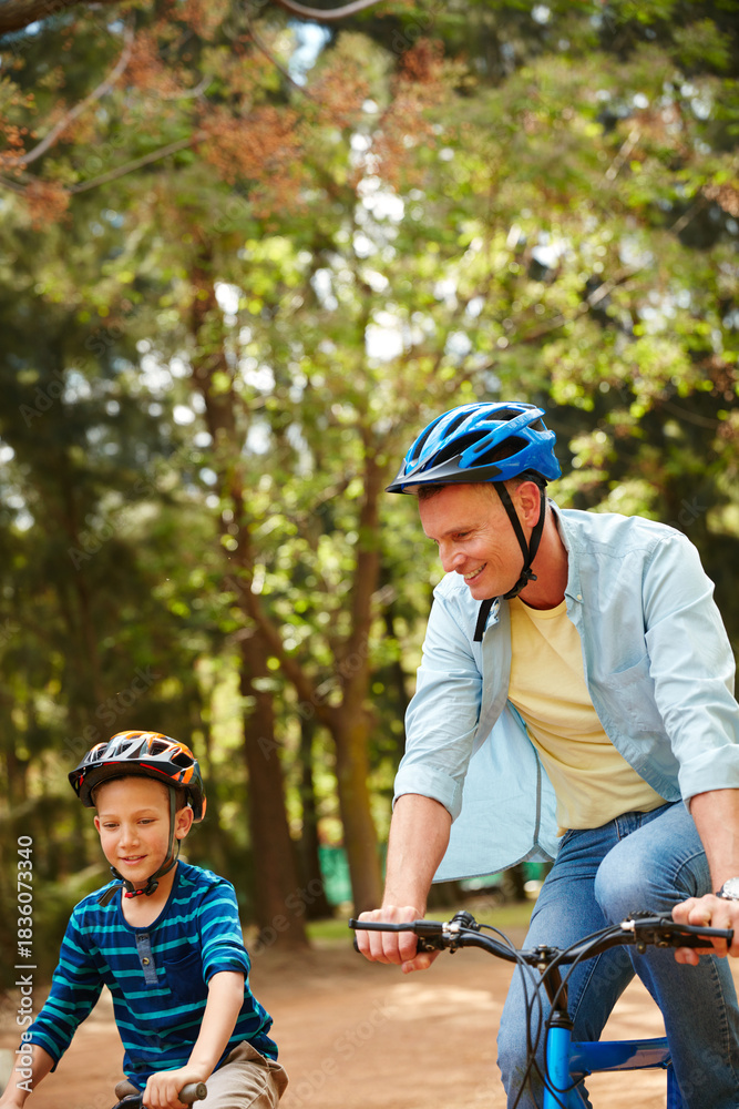 Obraz premium Happy, dad and child on bicycle, park and helmet for protection on journey, love and family on trip. Boy, learning and travel with man in nature, outdoor and development with eco friendly transport