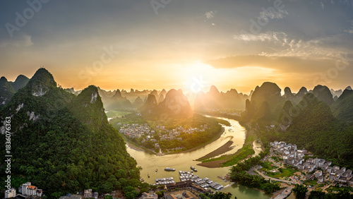 Aerial view of the winding river and mountain landscape at sunset in Guilin.