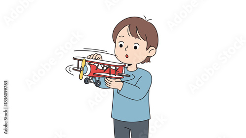 Boy playing with a toy airplane, eyes wide with excitement.