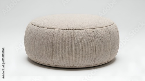A neutral-toned, cylindrical ottoman with vertically stitched panels, centered against white