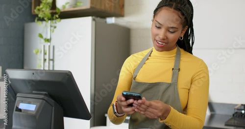 Barista and customer at cafe tapping POS unlocking reader while tapping smartwatch completing sale