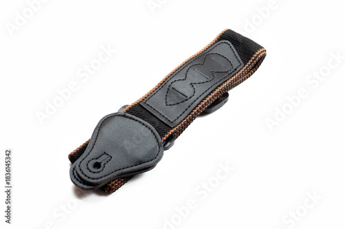 Black fabric strap for electric or acoustic guitar.