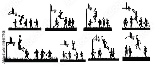 Basketball players silhouettes in action on grass dunk