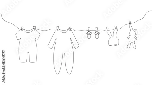 Cute kids' clothing hanging on a rope drawn in one line. Sketch. Continuous line drawing of baby things. Hand-drawn vector illustration in minimalist style