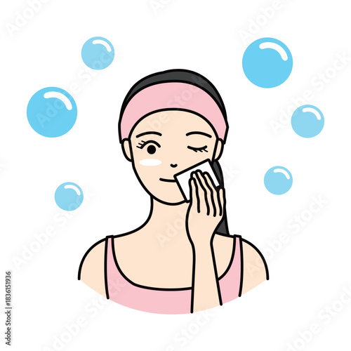 Woman applying toner or lotion with a cotton pad to her face
