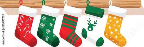 Five colorful Christmas stockings with various festive patterns hanging on a wooden mantelpiece, ready for gifts.