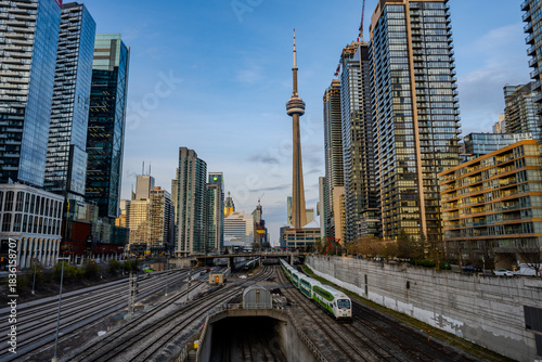Commuter train tracks leading into downtown Toronto skyline