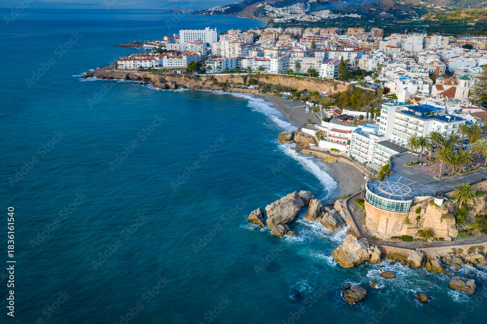 Fototapeta premium Aerial View of the Balcón de Europa Lookout Point and the Dramatic Coastline of Nerja, Andalusia, on the Mediterranean Sea