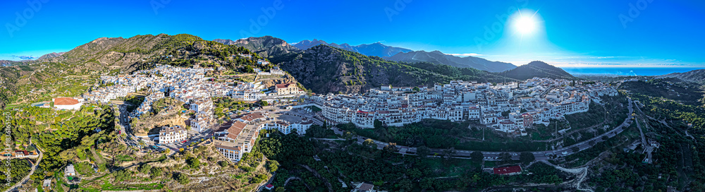 Naklejka premium Golden Hour Village: Stunning Aerial Sunrise View Over Frigiliana, the Iconic White Village Pueblo Blanco of Andalusia, Spain