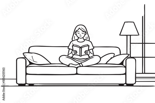 A woman is sitting on a couch reading a book. The scene is calm and peaceful, with the woman fully immersed in her reading. The couch is positioned in a way that allows her to comfortably sit and read