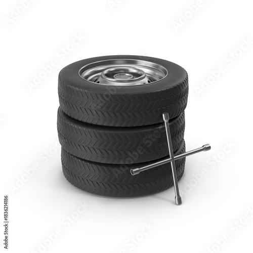 Three black rubber car tires stacked with chrome cross lug wrench