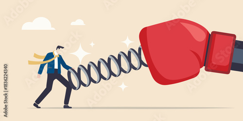 Businessman avoiding a springing boxing glove representing dodging workplace aggression or competition
