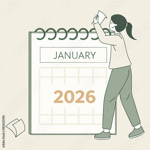 Person Changing Calendar to January 2026 Planning for the Future.