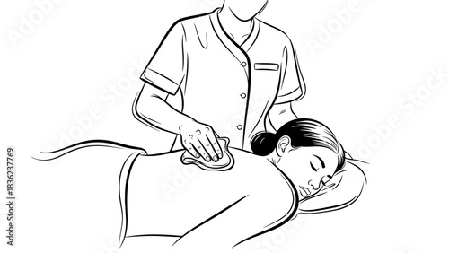 Therapist wiping oil from client's back