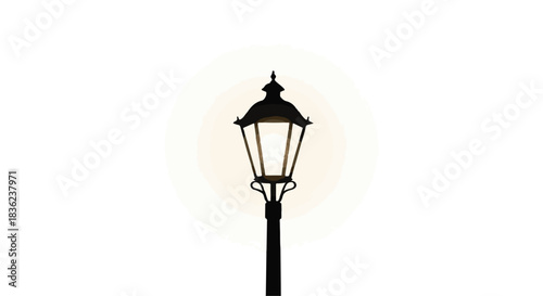 Classic lamppost glowing warmly against a soft light.